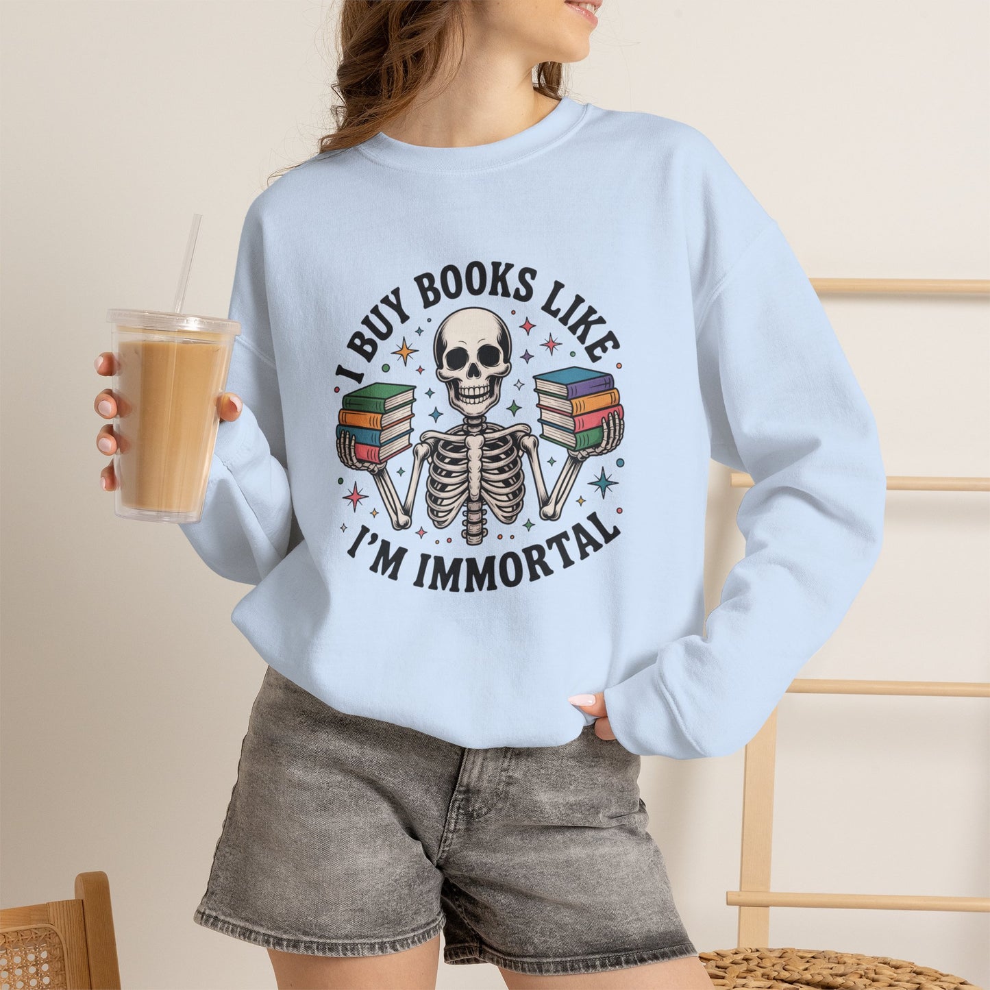 Book Lover Sweatshirt — "I Buy Books Like I’m Immortal" Skeleton Reading Crewneck - Back has Northkind's blueprint for bookish heaven