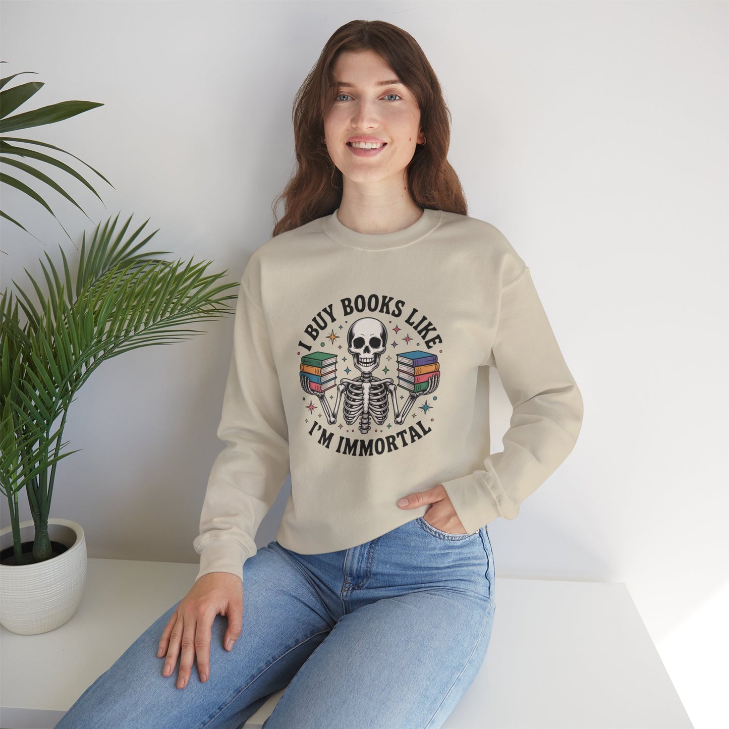 Book Lover Sweatshirt — "I Buy Books Like I’m Immortal" Skeleton Reading Crewneck - Back has Northkind's blueprint for bookish heaven