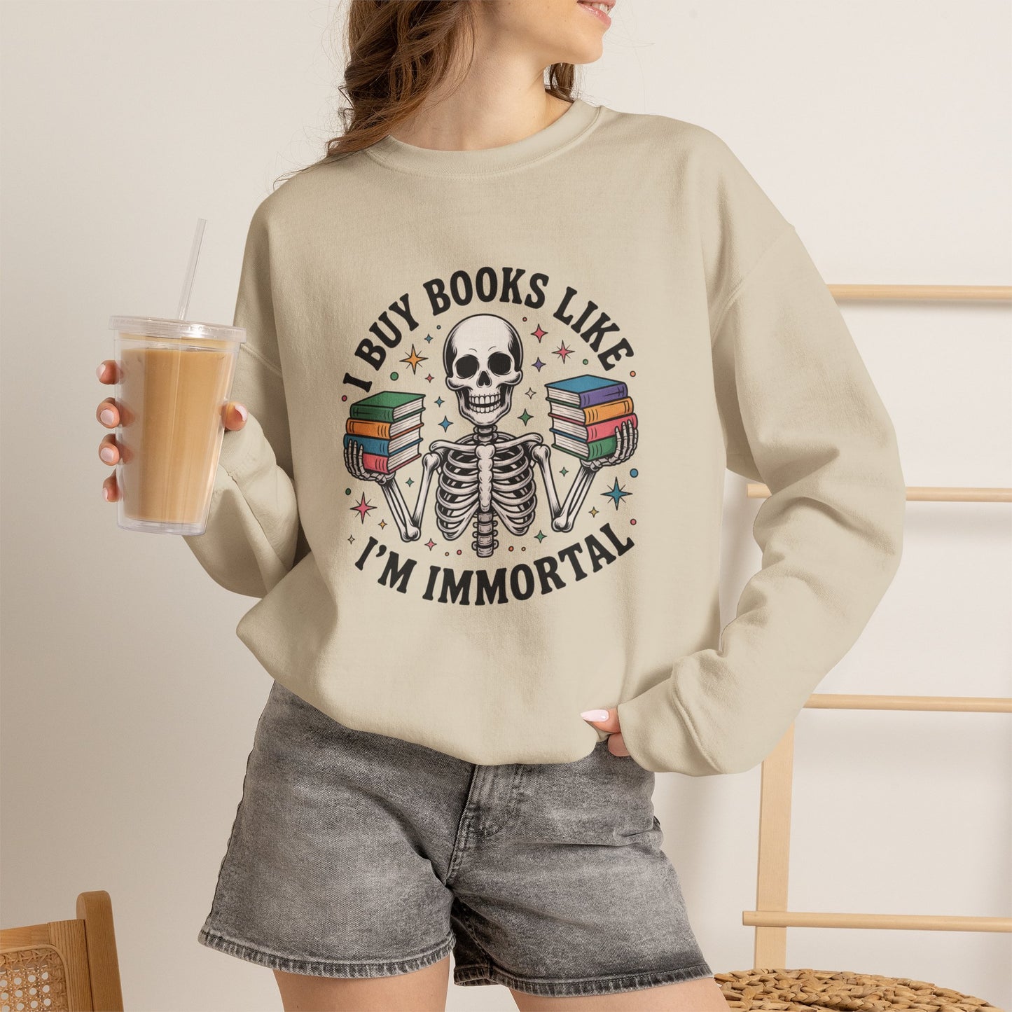 Book Lover Sweatshirt — "I Buy Books Like I’m Immortal" Skeleton Reading Crewneck - Back has Northkind's blueprint for bookish heaven