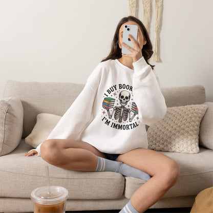 Book Lover Sweatshirt — "I Buy Books Like I’m Immortal" Skeleton Reading Crewneck - Back has Northkind's blueprint for bookish heaven