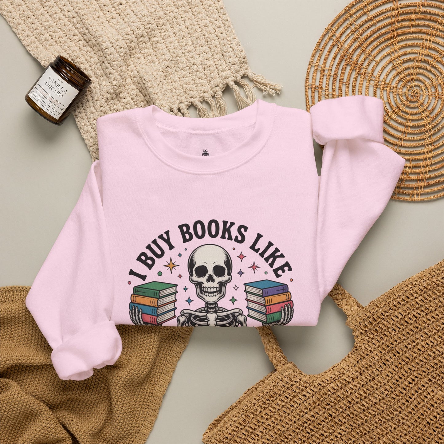 Book Lover Sweatshirt — "I Buy Books Like I’m Immortal" Skeleton Reading Crewneck - Back has Northkind's blueprint for bookish heaven
