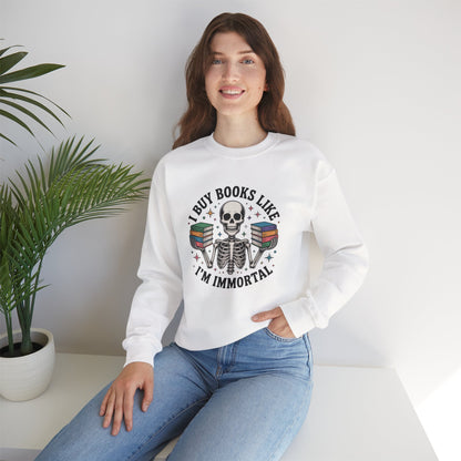 Book Lover Sweatshirt — "I Buy Books Like I’m Immortal" Skeleton Reading Crewneck - Back has Northkind's blueprint for bookish heaven