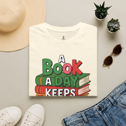 'A Book a Day Keeps Reality Away' T-Shirt — Stack of Books Graphic